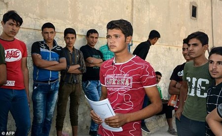 Long-term truants make nervy school return in Iraq's Mosul